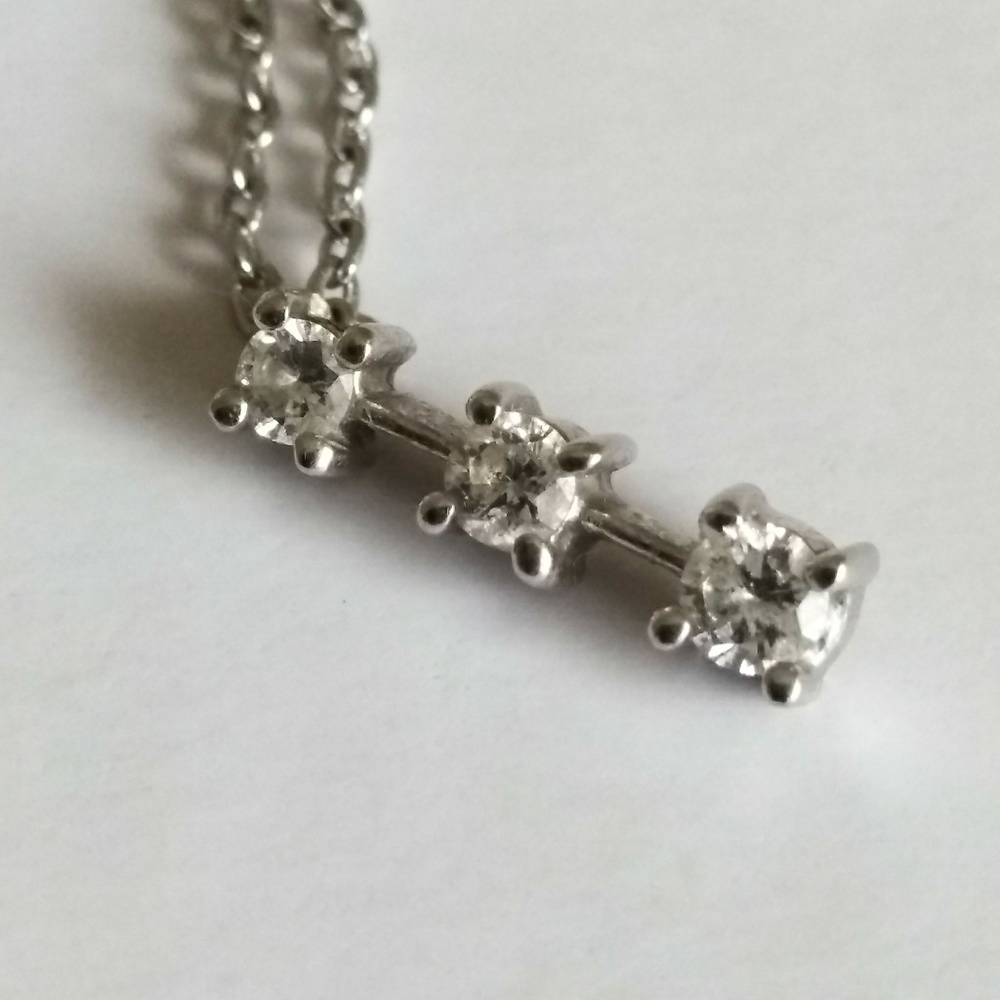 14k white gold diamond pendant.